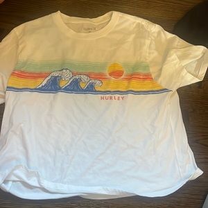 This is a white Hurley shirt with a different color wave in the middle.